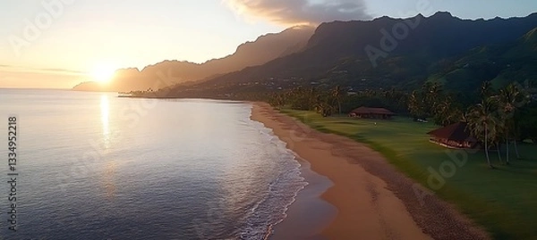 Obraz A beautiful ocean sunrise over a beach with palm trees