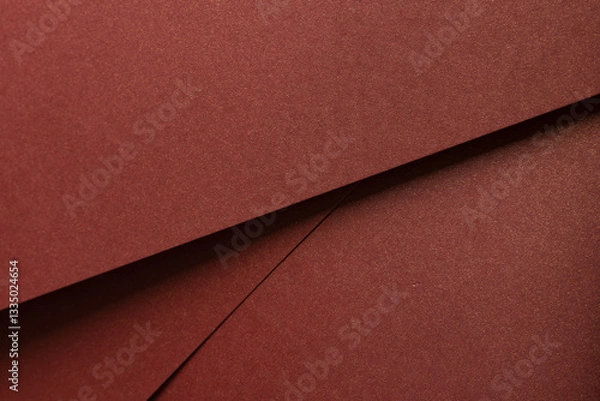Fototapeta Burgundy paper background with a matte texture and subtle shimmer. Warm, rich tones create an elegant, luxurious backdrop, perfect for designer paper, premium stationery, and artistic, chic.