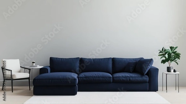 Fototapeta A cozy minimalist living room with a deep navy blue oversized sofa, complemented by a matching armchair and side table