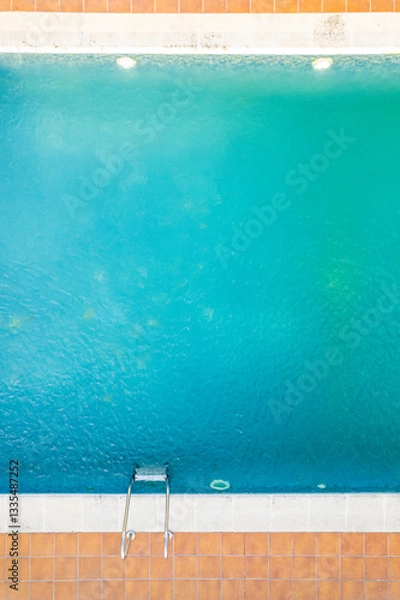 Fototapeta partial view of a swimming pool in a family house, aerial top view with drone