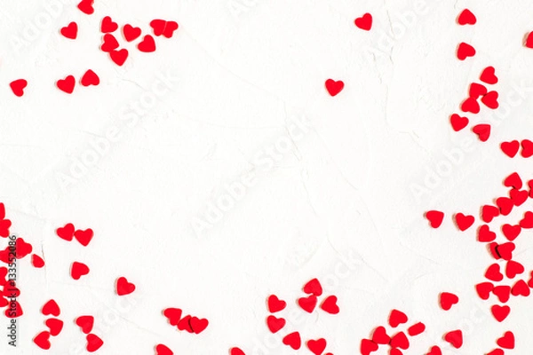 Fototapeta Festive background with sugar decorations in shape of a hearts