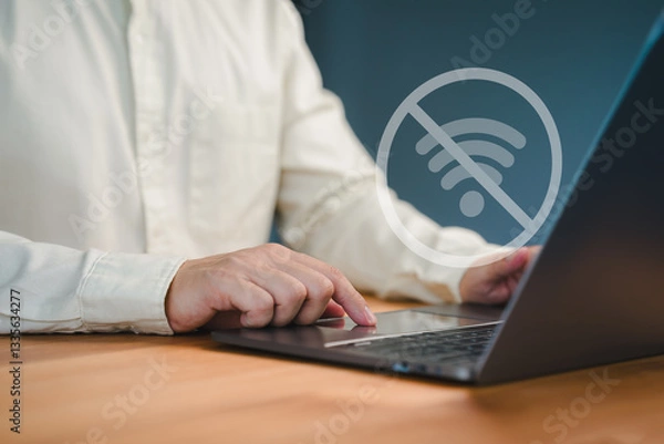 Obraz Male person using a laptop computer to connect to wifi, representing internet connectivity issues, network failure, offline mode, or technology disruption.