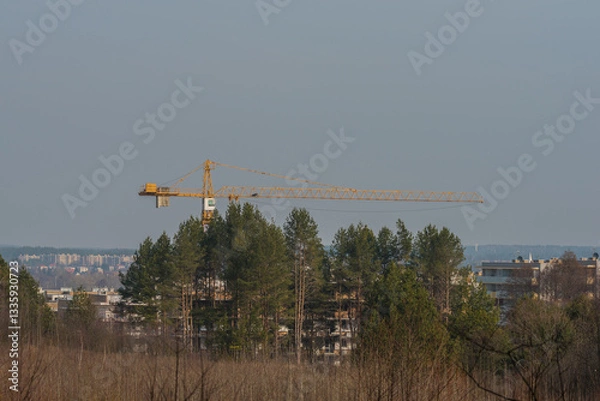 Fototapeta a large crane working on a new block
