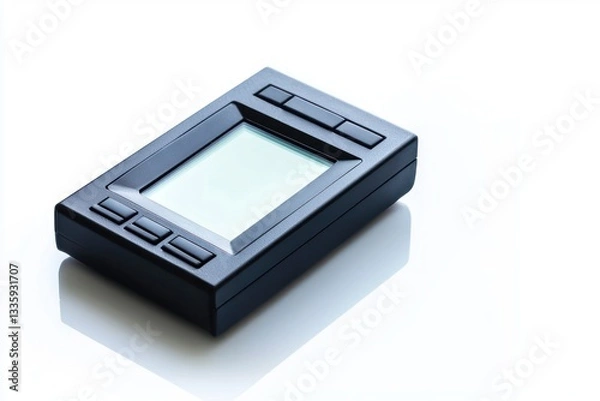 Obraz Black rectangle device on white surface illuminated by soft light digital display technology