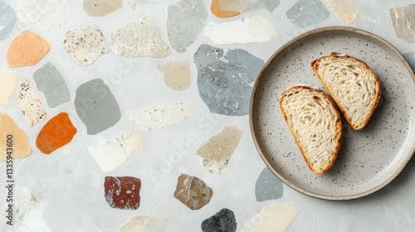 Fototapeta A plate of bread and a table with a mosaic pattern.