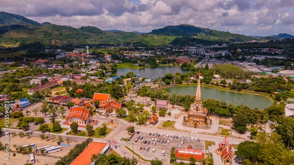 Obraz A drone aerial view of Wat Chalong is the most important temple of Phuket, Thailand.  and 1 of 5 must come in the afternoon