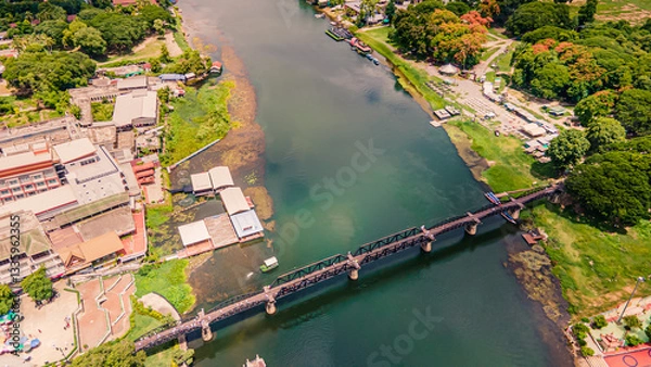 Obraz The Bridge on the River Kwai, Kanchanaburi, Thailand.The Death Railway, World War II, by the Japanese Army, which conscripted approximately 61,700 Allied prisoners of war. Opened 1943. Drone view.
