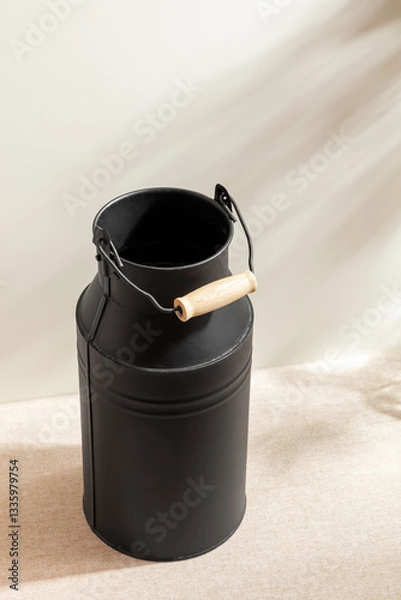 Obraz Black flower Container isolated on studio background. Minimalist. Product design. Simplicity. Object. Modern. Home decoration. Houseplant. Plant pot. Space for text.Light and Shadow.Simple black vase.
