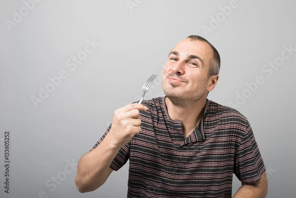 Fototapeta young man with a fork