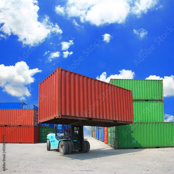 Obraz forklift handling the container box