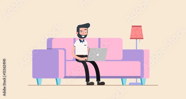 Fototapeta freelancer working at home with laptop computer on cozy sofa.