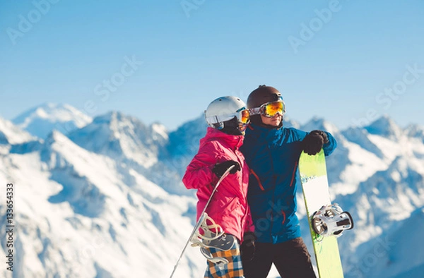 Obraz Happy couple of snowboarders in the alpine mountains