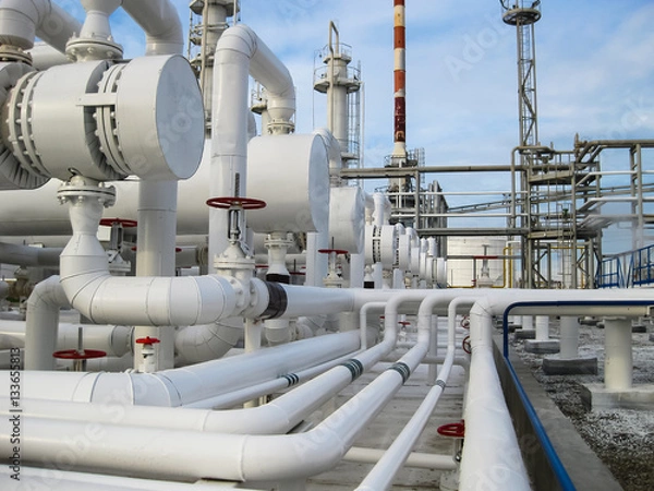 Fototapeta Heat exchangers in refineries. The equipment for oil refining. Heat exchanger for flammable liquids. The plant for the primary processing of oil
