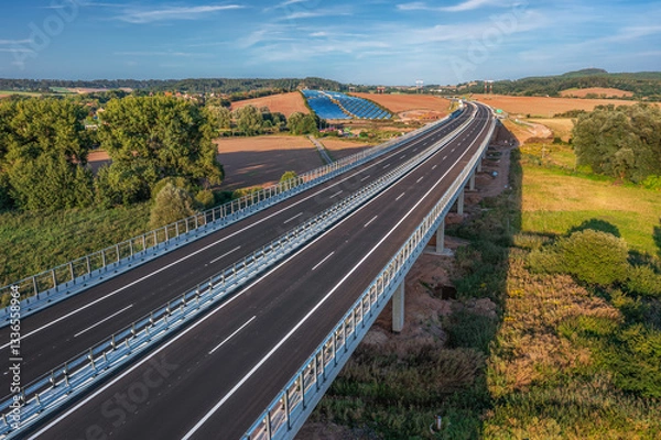 Obraz An empty highway bridge stretches across the Czech landscape, seen from above. Highway D6 from Prague to Karlovy Vary and Cheb.