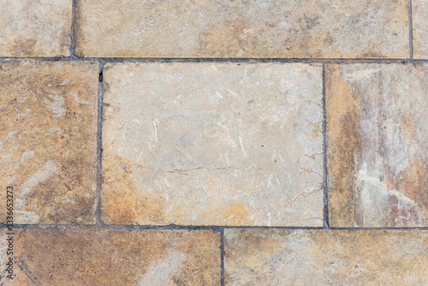 Obraz Sidewalk in Valletta, Malta. Close-up of grey-yellowish pavement tiles, capturing texture and pattern. Ideal as a background image for design and urban themes.