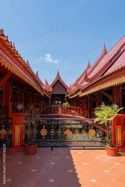 Fototapeta Restaurant over the water in Ko Panyi or Koh Panyee, fishing village in Strait of Malacca, Phang Nga Province, Thailand, notable for being built on stilts by Javanese fishermen. Vertical image