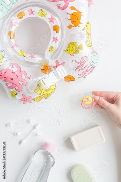 Fototapeta baby accessories for bath with duck on white background