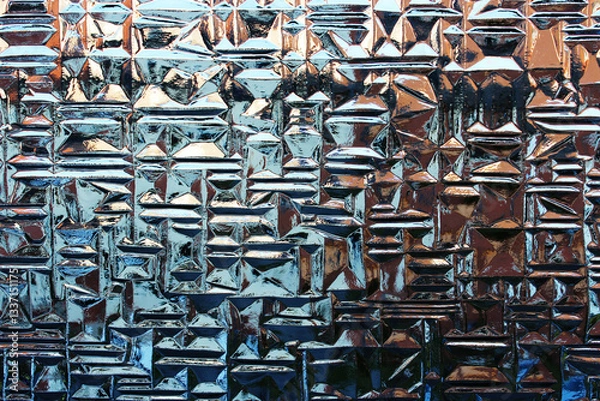 Fototapeta Close-up of a patterned window with reflections