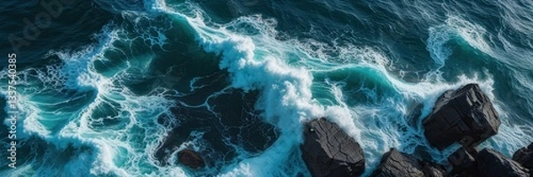 Fototapeta Dramatic ocean scene with powerful waves crashing against rugged rocks from above