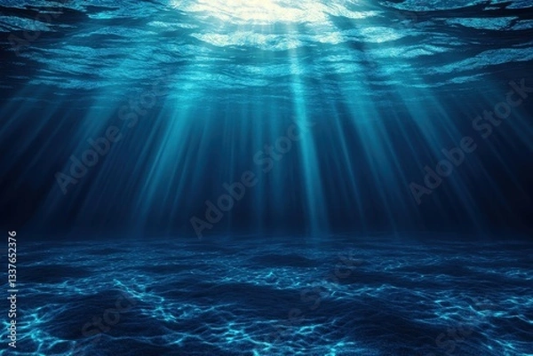 Fototapeta Sunlight beams illuminate the deep blue underwater scene.