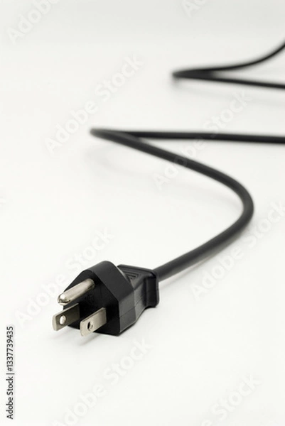 Obraz Electric plug with black cord designed for US outlets on a neutral background