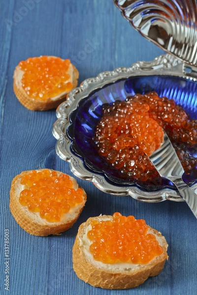 Obraz Red caviar toasts and caviar shell plate