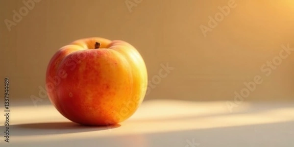 Fototapeta Golden Hour Nectarine A Single, Ripe Fruit Basking in Warm Sunlight on a Smooth Surface