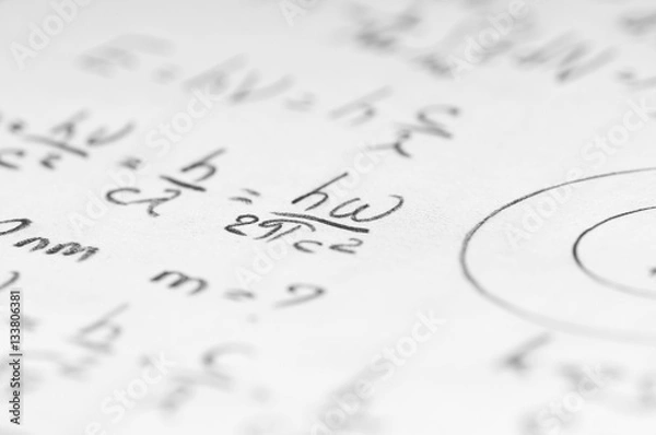 Obraz sheet of paper filled with calculations of nuclear and quantum p