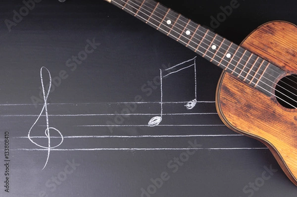 Obraz Vintage Guitars on chalkboard with music notes
