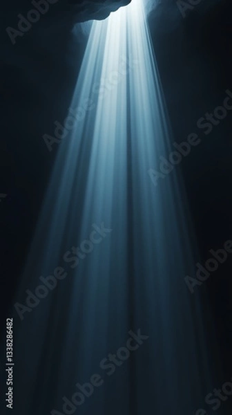 Fototapeta Rays of Light Shining Through Dark Cave Entrance Creating Dramatic Scene