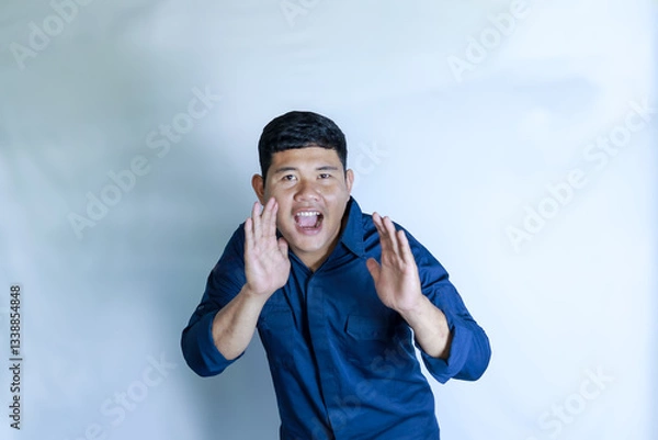 Obraz A young man felt happy, shouting loudly with his hand beside his mouth