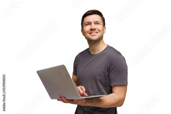 Fototapeta Man smiling while using a laptop, seemingly engaged in a positive activity at home