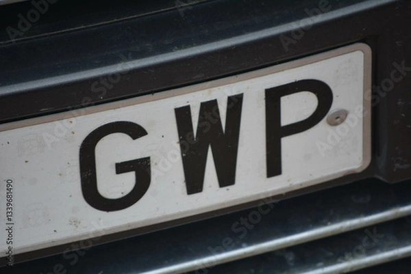 Fototapeta High-quality image of a Spanish license plate (matrícula española) on a vehicle, showcasing the European Union blue strip with the 'E' country code for Spain. 