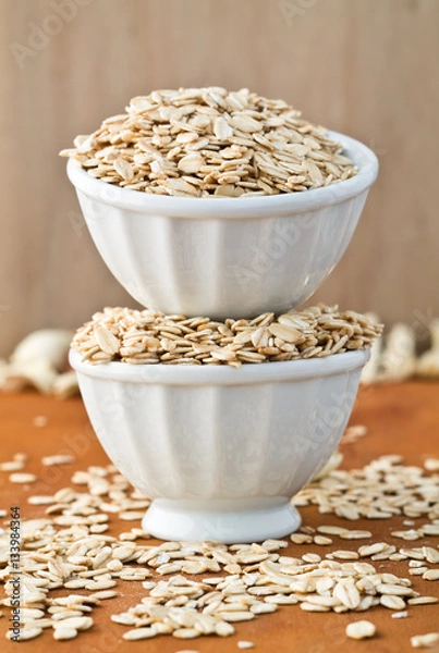 Obraz oat flakes on wooden surface