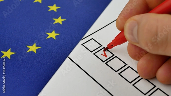 Obraz Hand marks choice with red marker on ballot. Elections in EU. Blue flag with yellow stars. Secure voting process guarantees fair political participation and democratic engagement across member states
