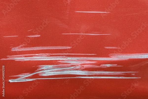 Obraz Close up of a red car with multiple visible scratches and paint damage The scratches expose the underlying metal, creating a contrast against the glossy surface. Perfect for automotive damage concepts