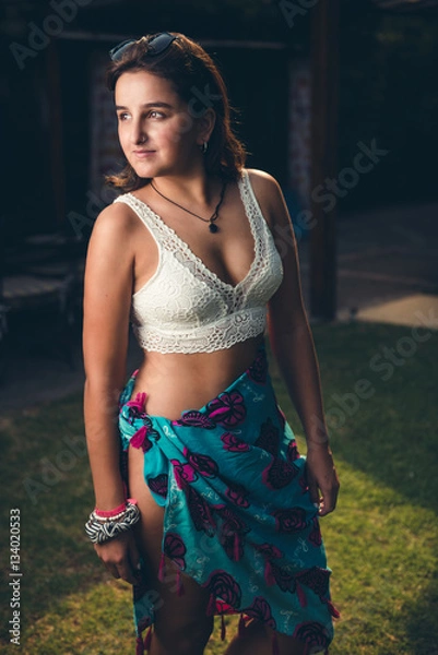 Fototapeta Young woman posing on the lawn