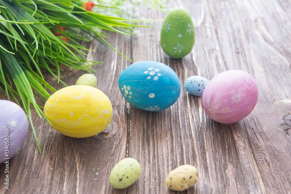 Fototapeta Easter rabbit with Easter eggs on wooden background. Close-up.