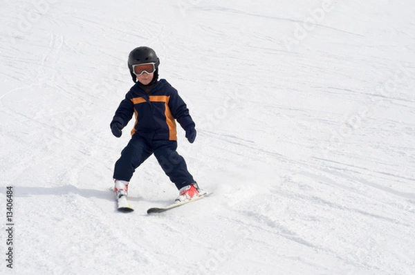 Obraz Four year old child skiing alone