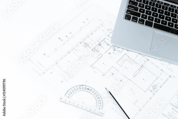 Fototapeta Pen, drawing rulers, and notebook over house construction bluepr