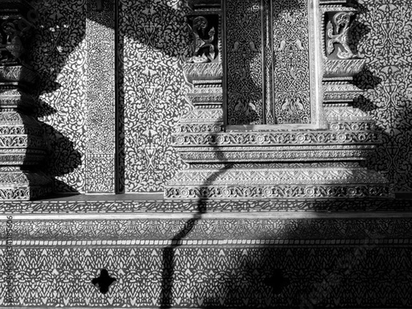 Fototapeta Shadows of Patterns: Light and Shadow at Wat Phiphat Mongkol (Black and White)