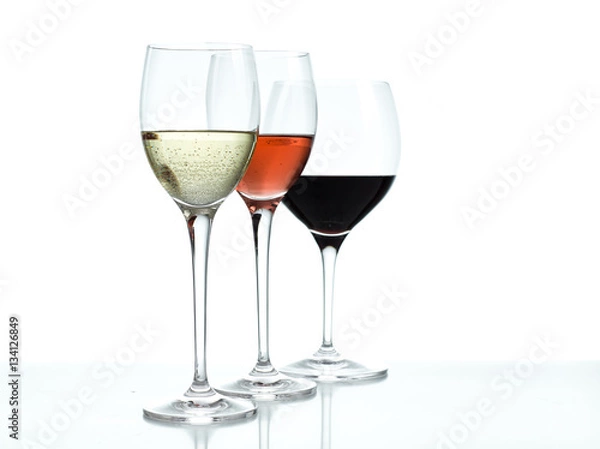 Obraz Glasses of red, white and rose wine on a white background
