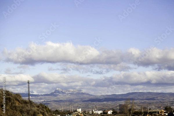 Fototapeta Cityscape with mountains