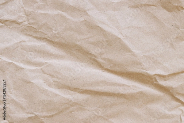 Fototapeta Crumpled craft paper background. Crumpled craft paper texture or paper background. Background with copy space. Top view. Space for text. Close-up view of crumpled brown paper texture