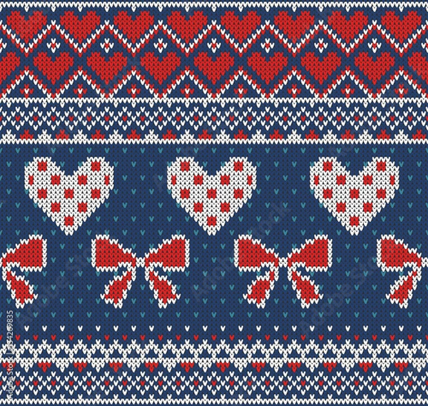 Obraz Seamless pattern on the theme of holiday Valentine's Day with an image of the Norwegian and fairisle patterns. Red, white bows and hearts on a blue background. Vector Illustration