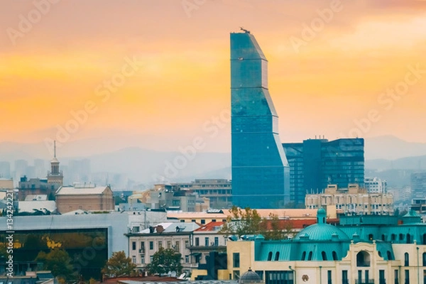 Fototapeta Tbilisi, Georgia. Skyscraper Surrounded By Buildings Of Soviet Time