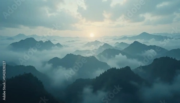 Obraz Ethereal mountain landscape veiled in mist, kissed by the soft glow of the rising sun