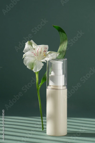 Obraz Beige tube with cream on green background with Light on wall with flowers and leaves. A cleansing make-up lotion for clean and fresh skin. Makeup remover in plastic packaging