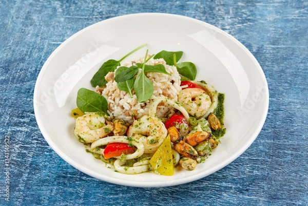 Obraz risotto with seafood on white plate