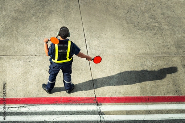 Obraz Airport worker directing